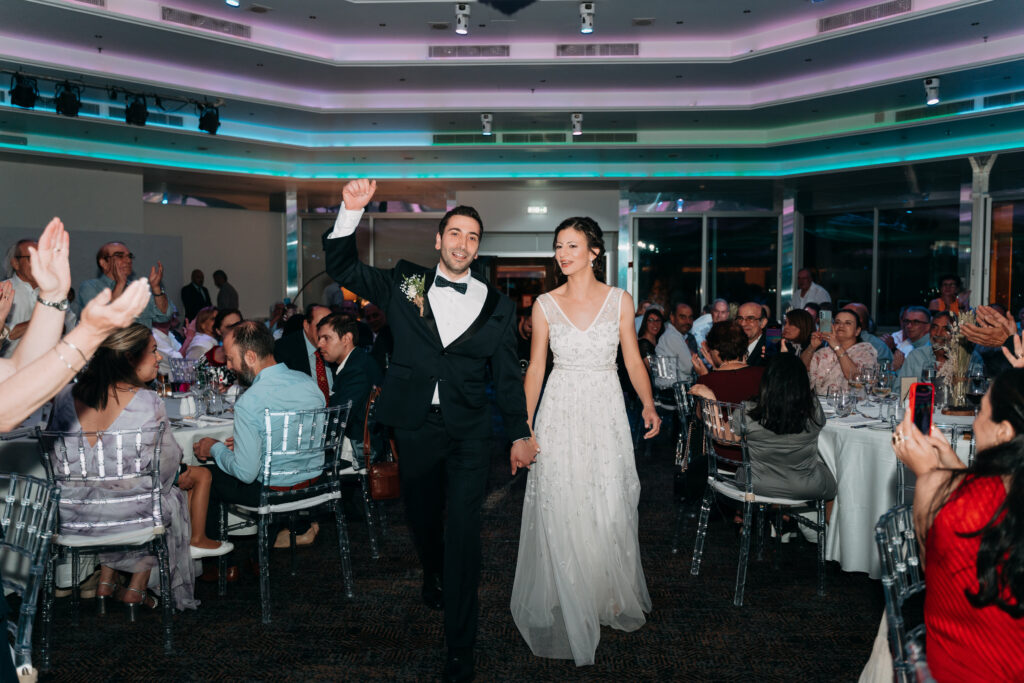 Bride and groom grand entrance at St Raphael Resort wedding in Limassol.